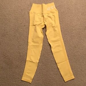XS Echt brand yellow in color leggings.
